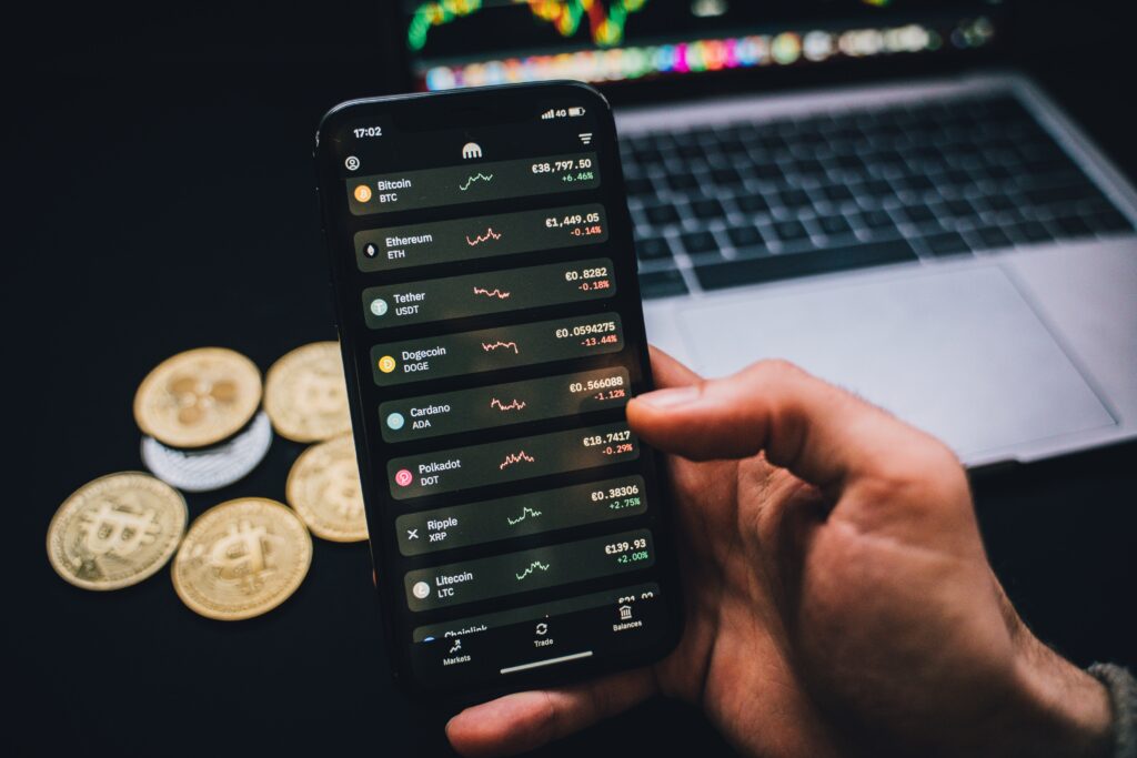 cryptocurrency and how it works : a smartphone with list of cryptocurrencies.